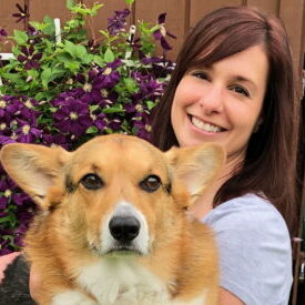 A photo of Dr. Stephanie Evenson with her heart dog Riley, a corgi.